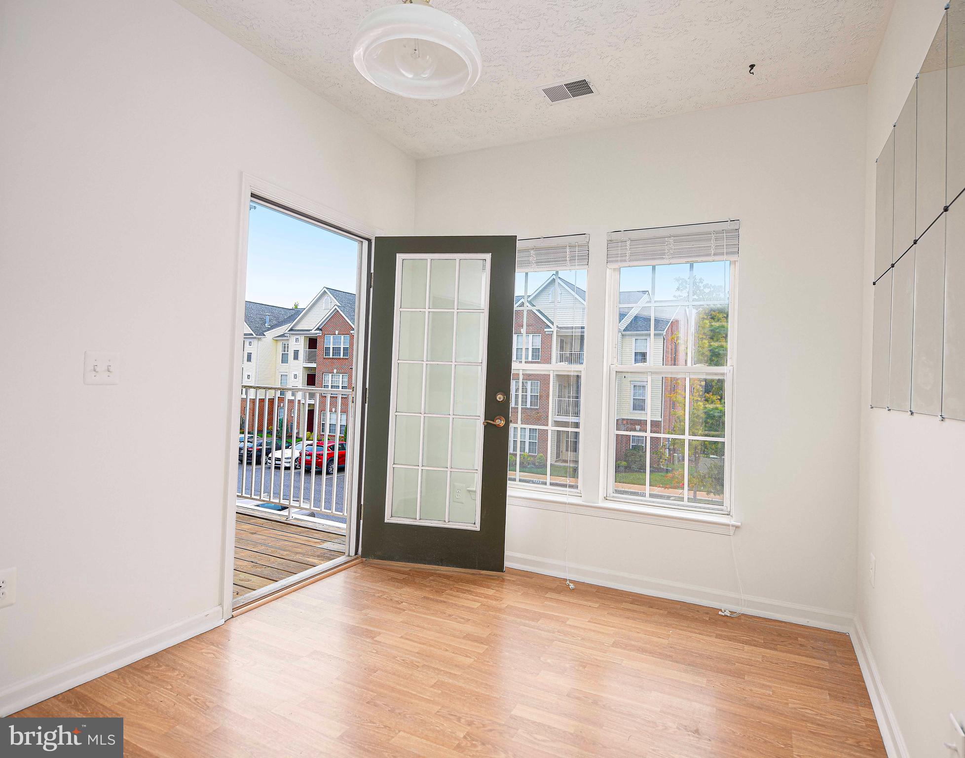9606 Haven Farm Road, Unit E Perry Hall, MD 21128 - Photo 19 of 33 an empty room with windows