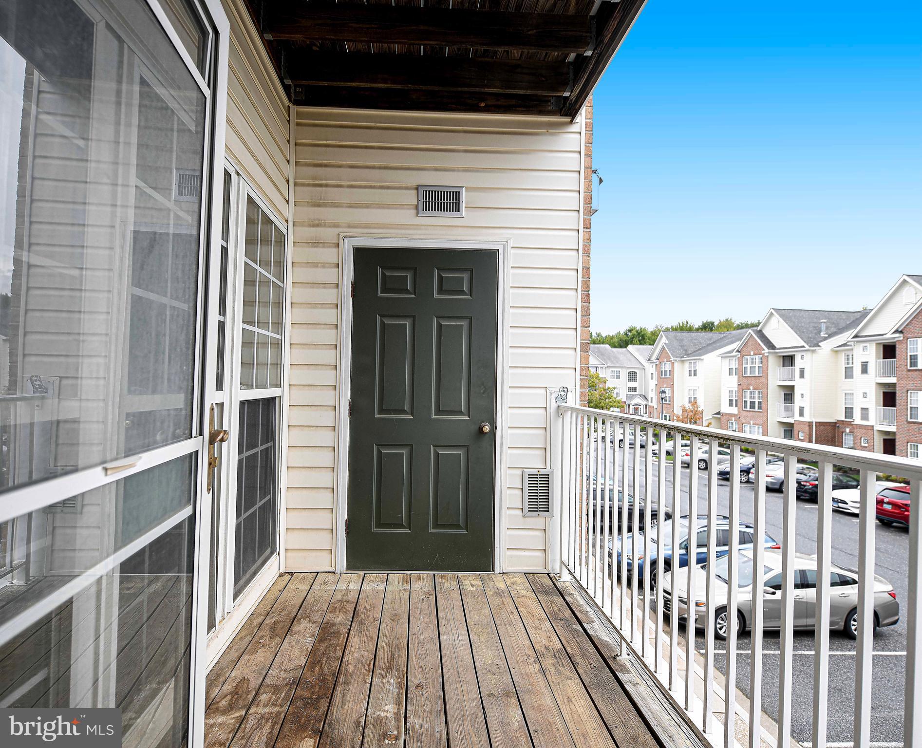 9606 Haven Farm Road, Unit E Perry Hall, MD 21128 - Photo 20 of 33 a view of a balcony with wooden floor
