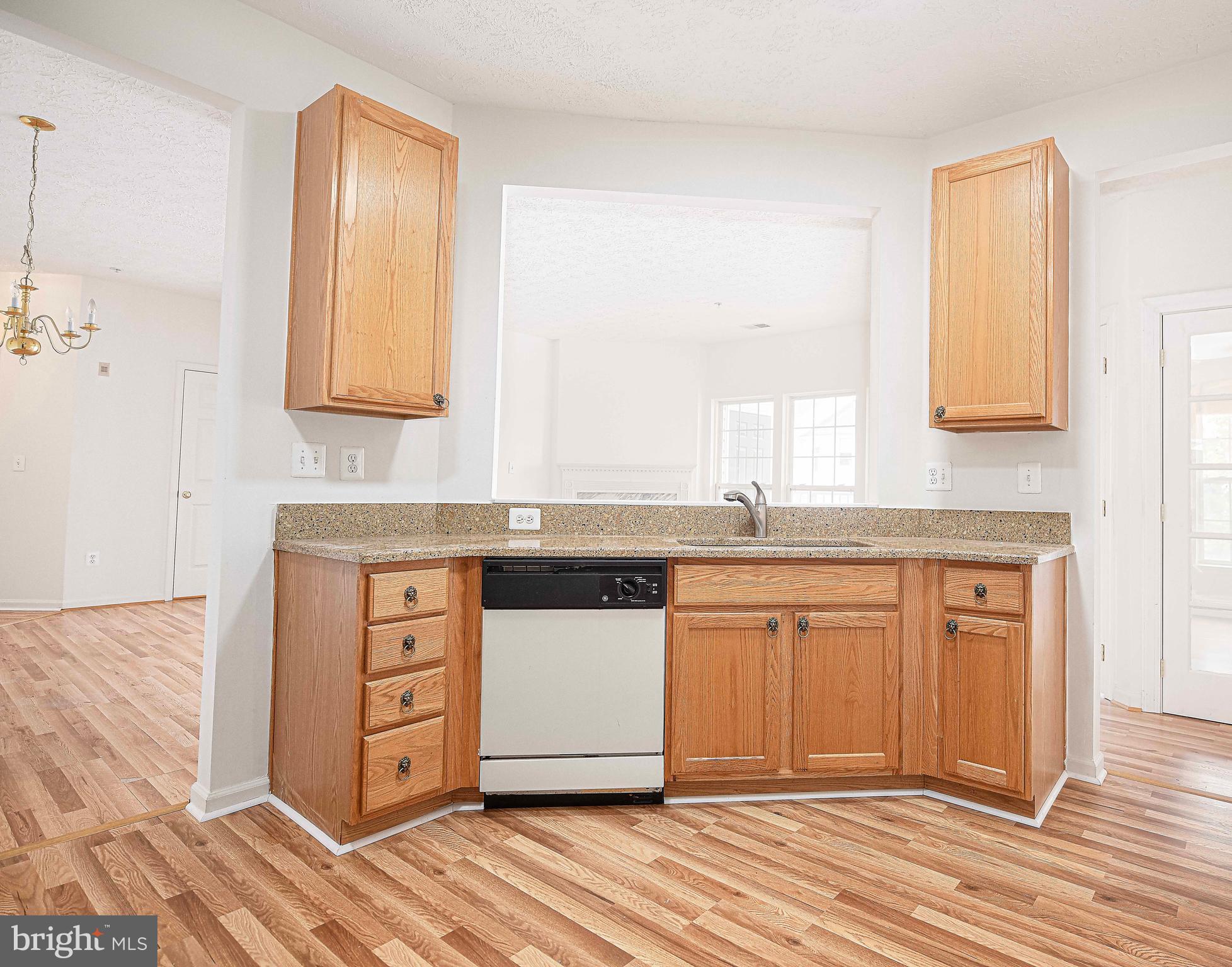 9606 Haven Farm Road, Unit E Perry Hall, MD 21128 - Photo 21 of 33 a spacious bathroom with a granite countertop sink and a mirror