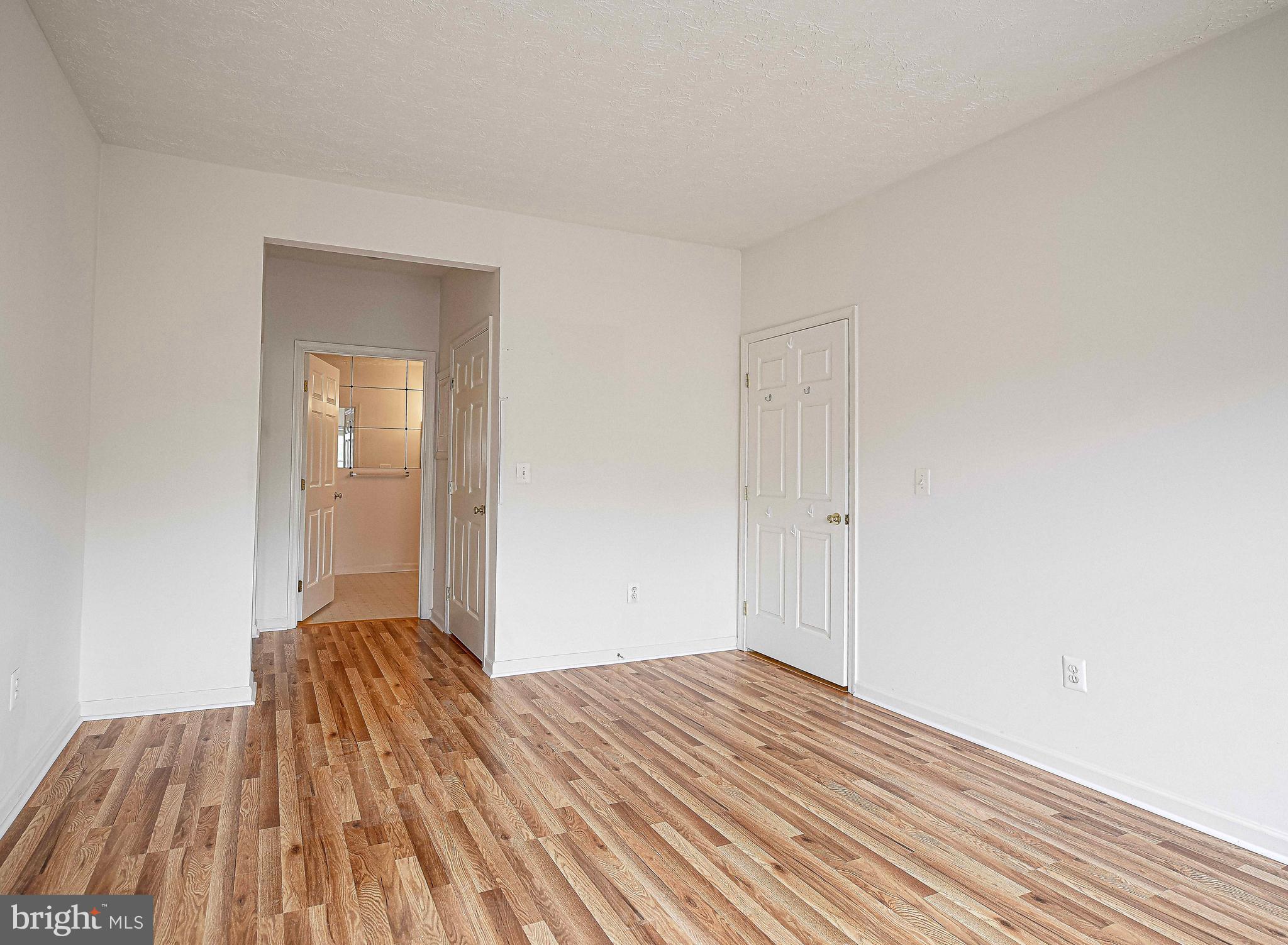 9606 Haven Farm Road, Unit E Perry Hall, MD 21128 - Photo 26 of 33 a view of a room with wooden floor and closet