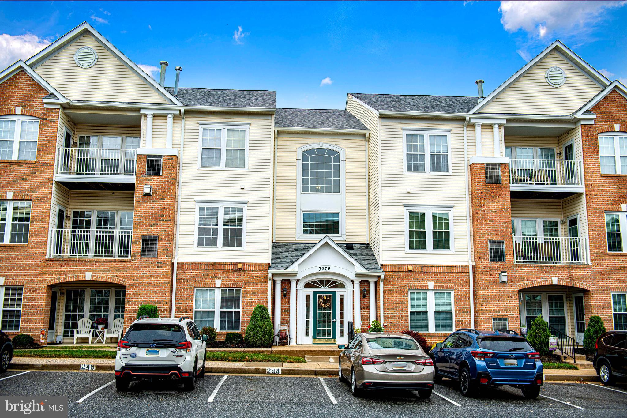 9606 Haven Farm Road, Unit E Perry Hall, MD 21128 - Photo 5 of 33 a car parked in front of a brick house