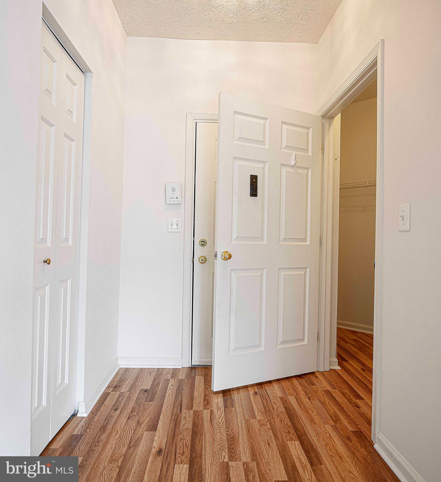 9606 Haven Farm Road, Unit E Perry Hall, MD 21128 - Photo 10 of 33 a view of a room with wooden floor and closet area