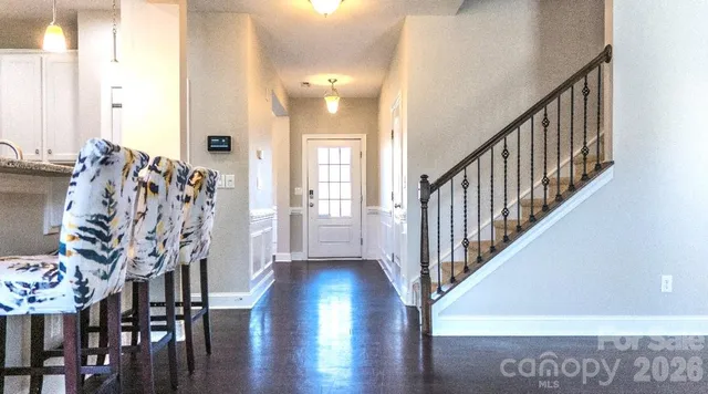 a view of entryway with wooden floor