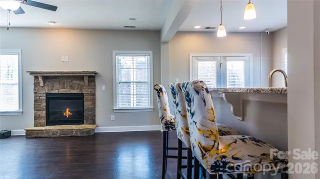 a view of a livingroom with furniture and a fireplace