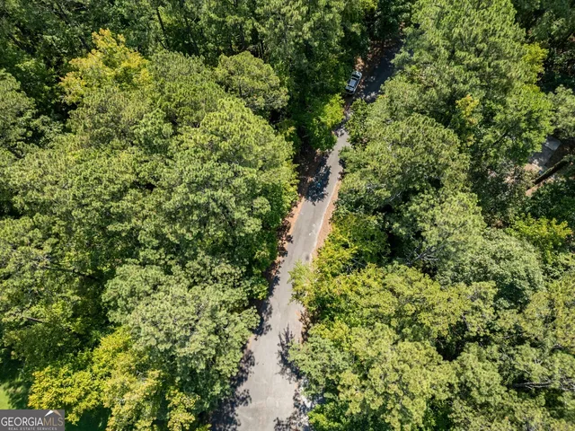 a view of a house with a tree