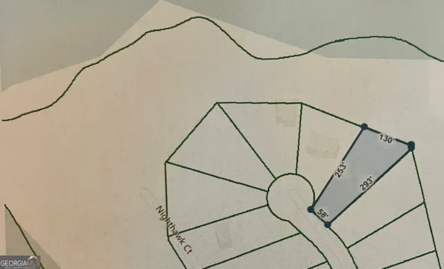 an aerial view of a house with a garden and lake view