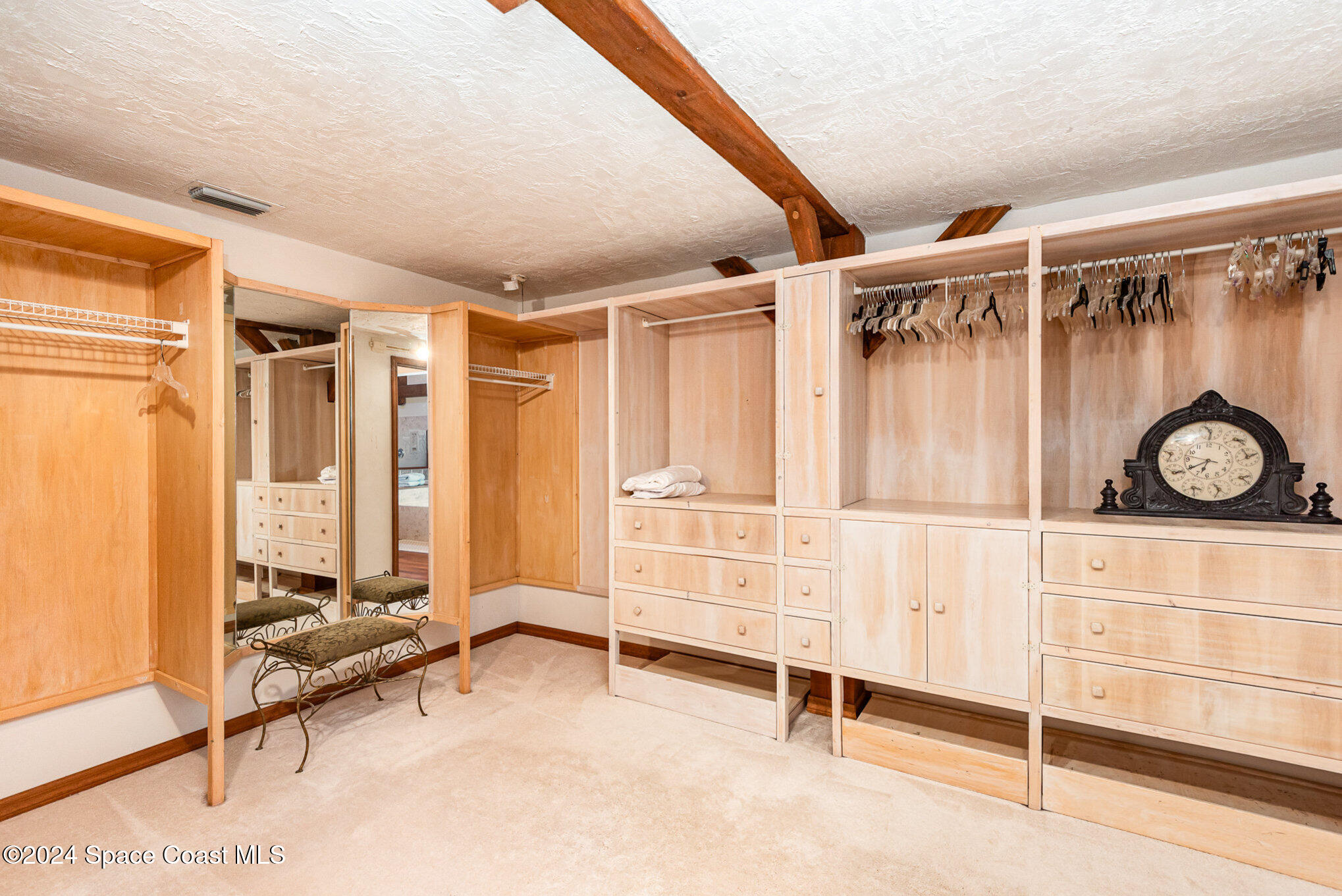3450 Grant Line Road Mims, FL 32754 - Photo 13 of 42 a view of walk in closet with clothes and shoes