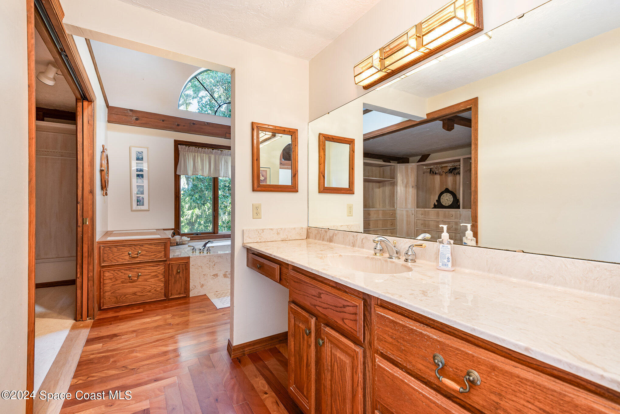 3450 Grant Line Road Mims, FL 32754 - Photo 14 of 42 a spacious bathroom with a granite countertop sink mirror and a