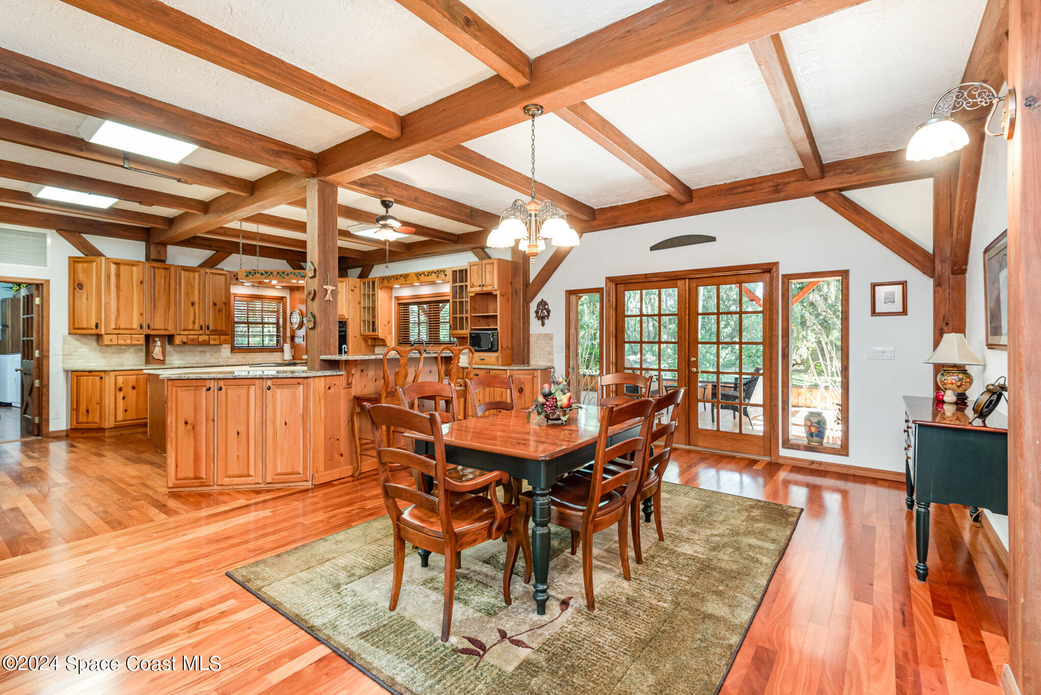 3450 Grant Line Road Mims, FL 32754 - Photo 18 of 42 a view of a dining room with furniture wooden floor and a rug