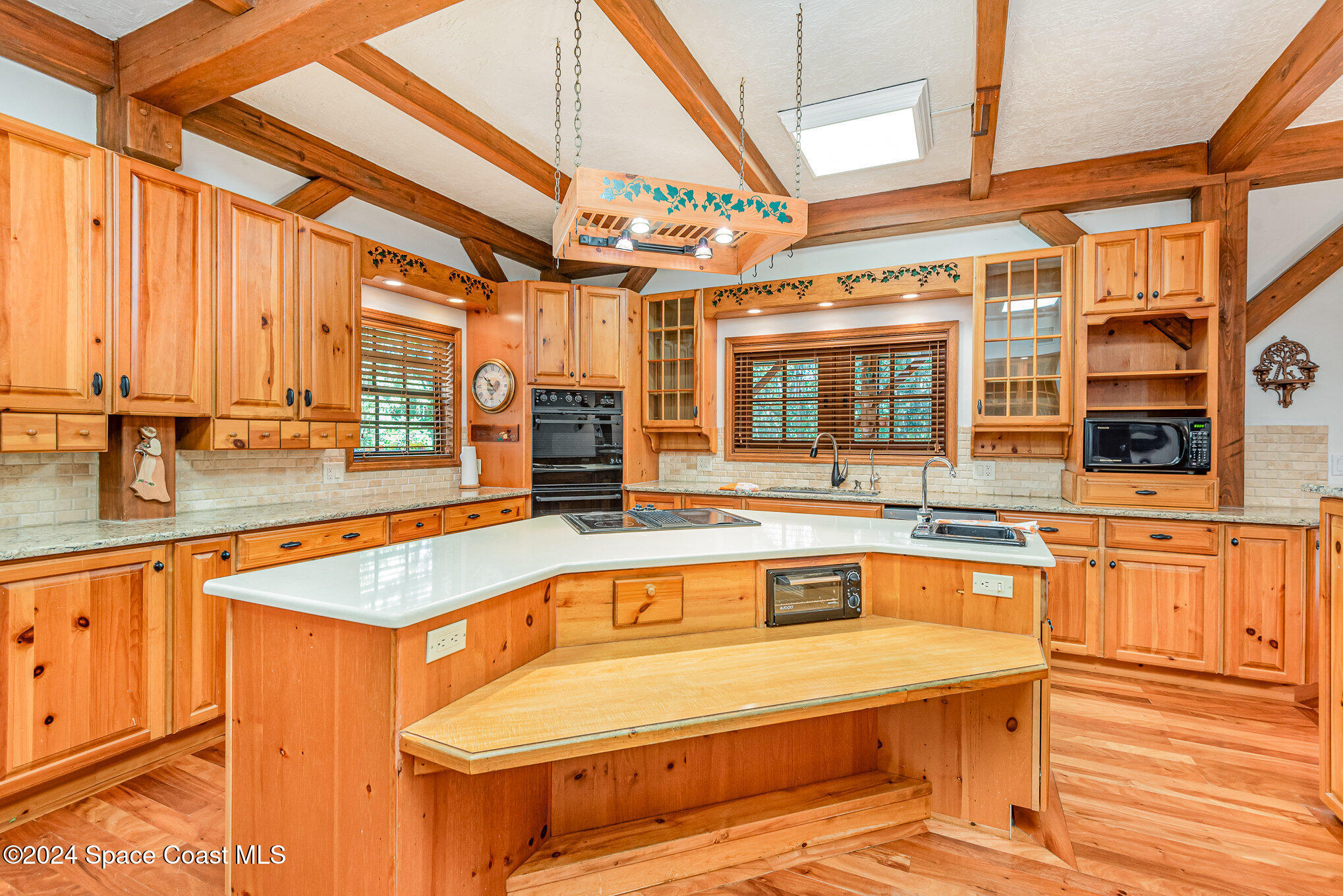3450 Grant Line Road Mims, FL 32754 - Photo 19 of 42 a view of a kitchen with a swimming pool