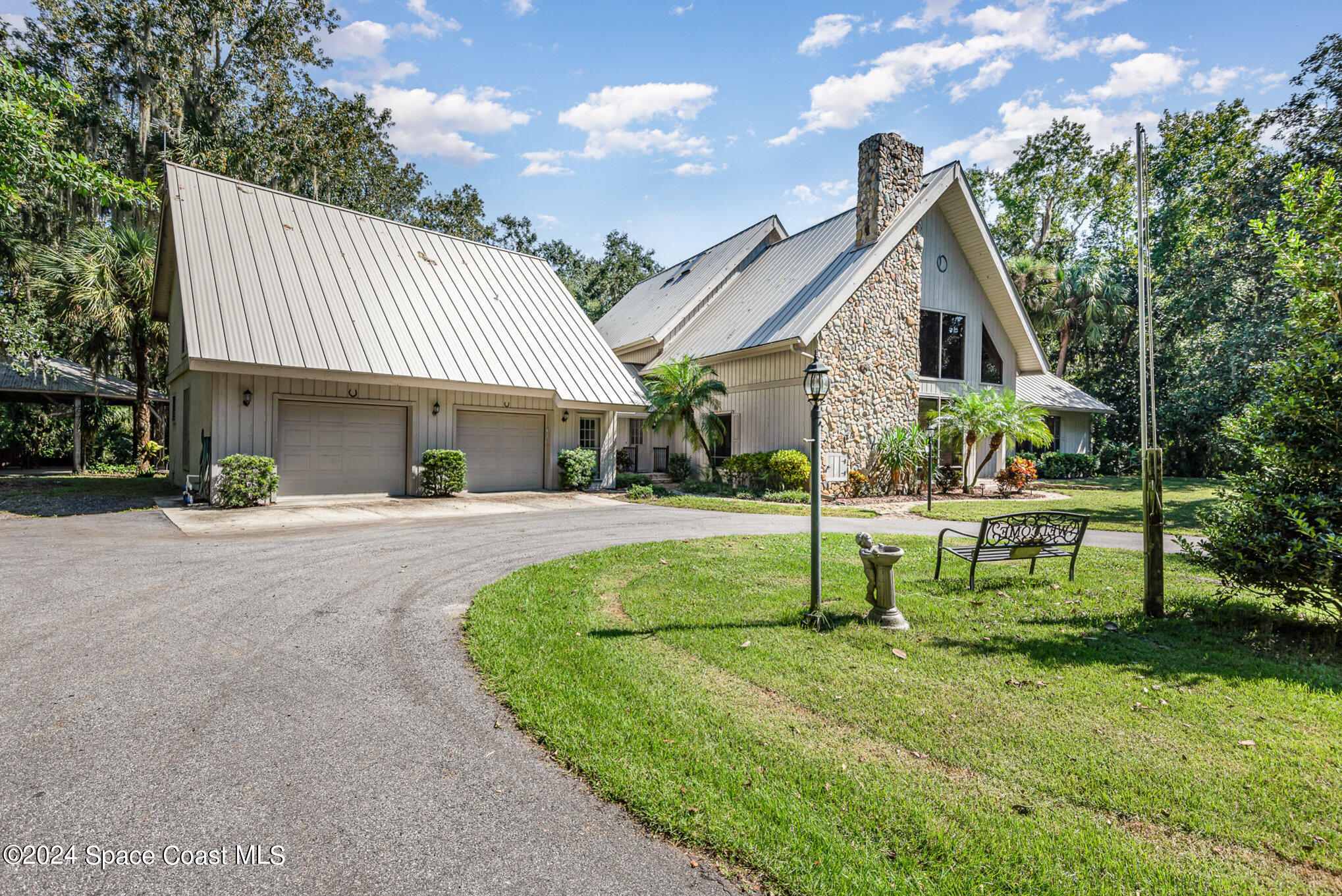 3450 Grant Line Road Mims, FL 32754 - Photo 2 of 42 a view of a house with backyard and sitting area