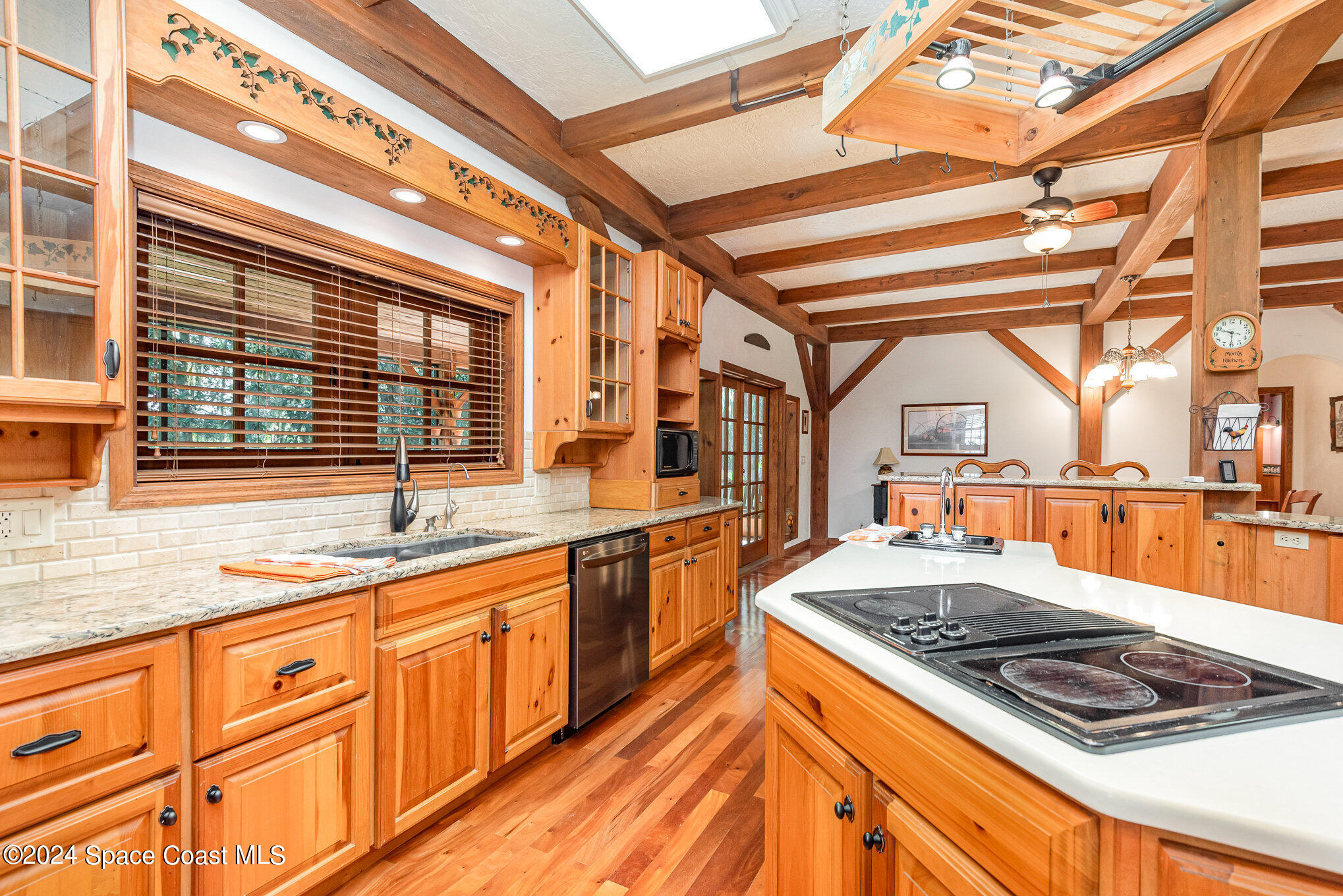 3450 Grant Line Road Mims, FL 32754 - Photo 21 of 42 a kitchen with stainless steel appliances granite countertop a stove and a sink