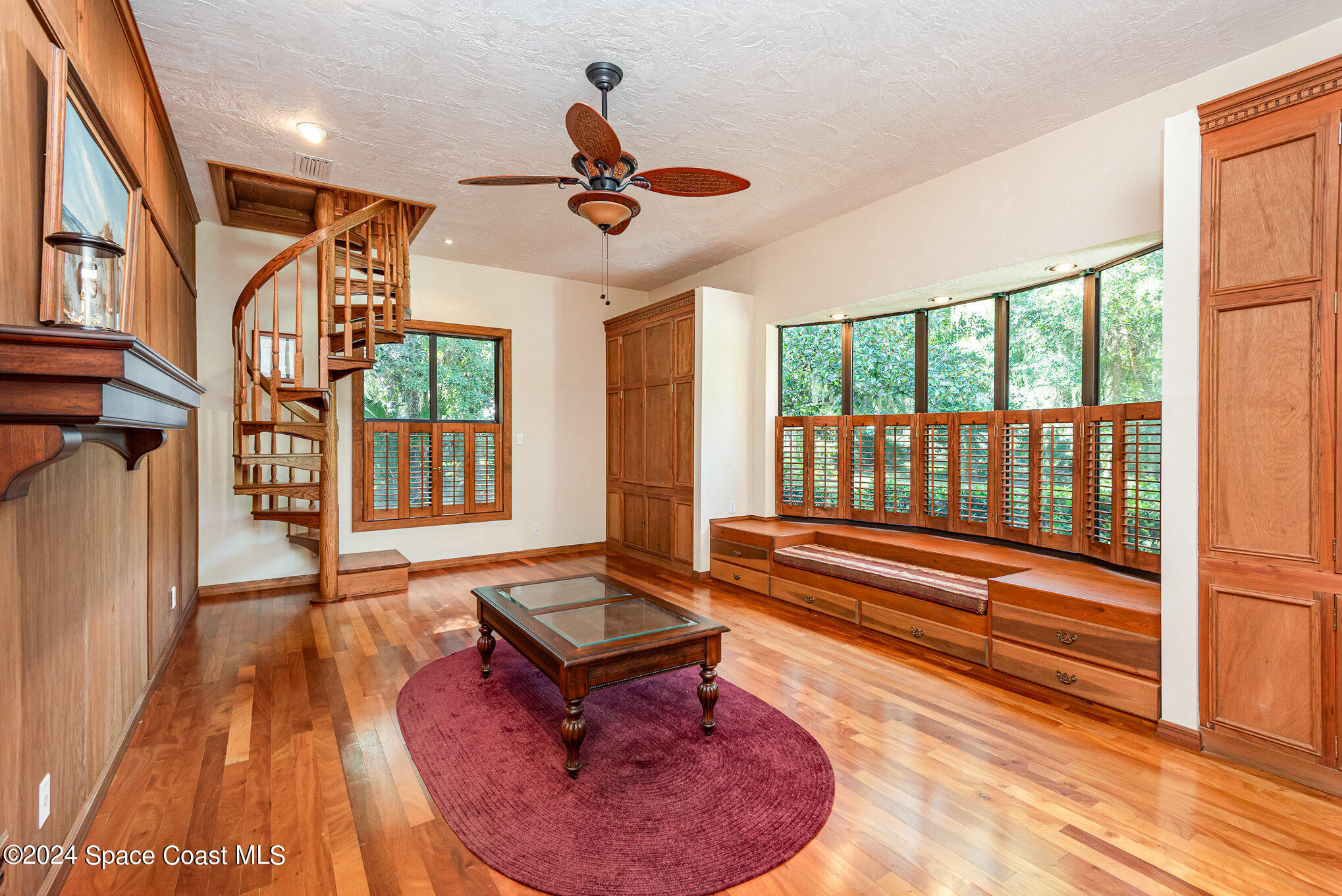 3450 Grant Line Road Mims, FL 32754 - Photo 24 of 42 a living room with furniture floor to ceiling window and wooden floor