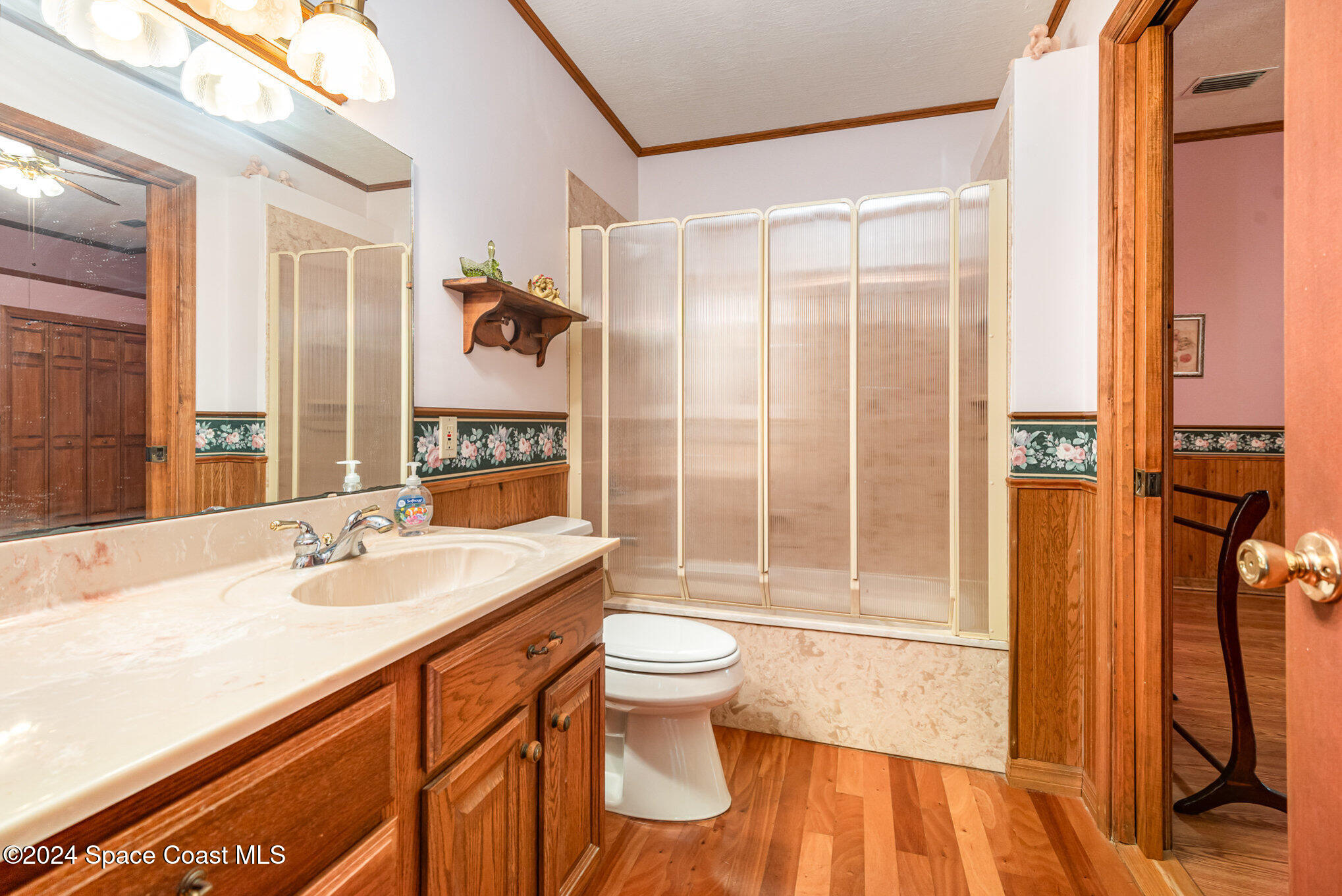 3450 Grant Line Road Mims, FL 32754 - Photo 25 of 42 a bathroom with a sink a toilet and shower