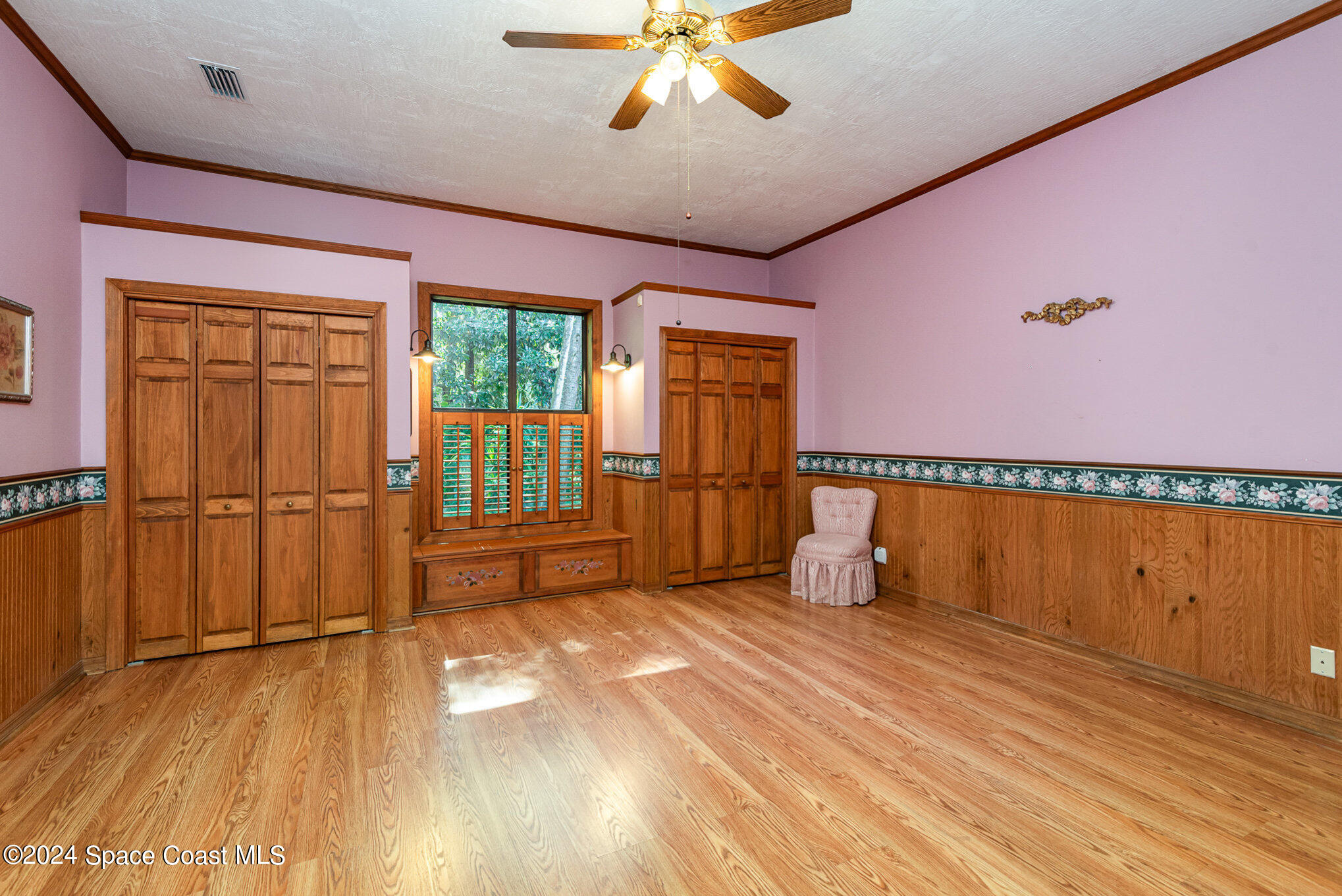 3450 Grant Line Road Mims, FL 32754 - Photo 26 of 42 a room with wooden floor and windows