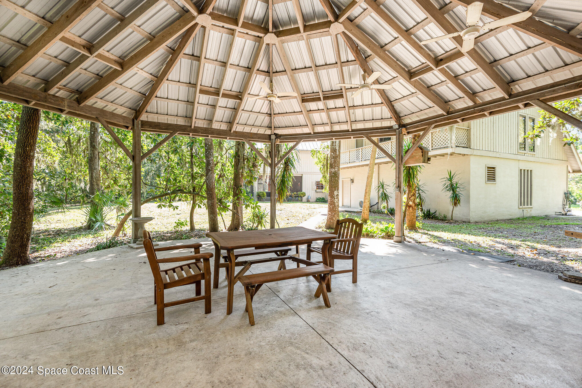 3450 Grant Line Road Mims, FL 32754 - Photo 35 of 42 a patio area with table and chairs
