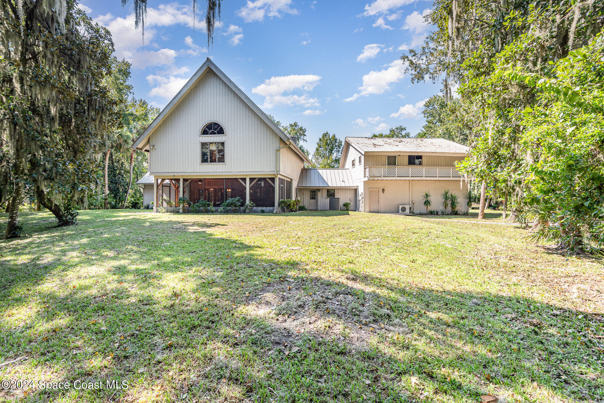 3450 Grant Line Road Mims, FL 32754 - Photo 38 of 42 a view of a house with a yard