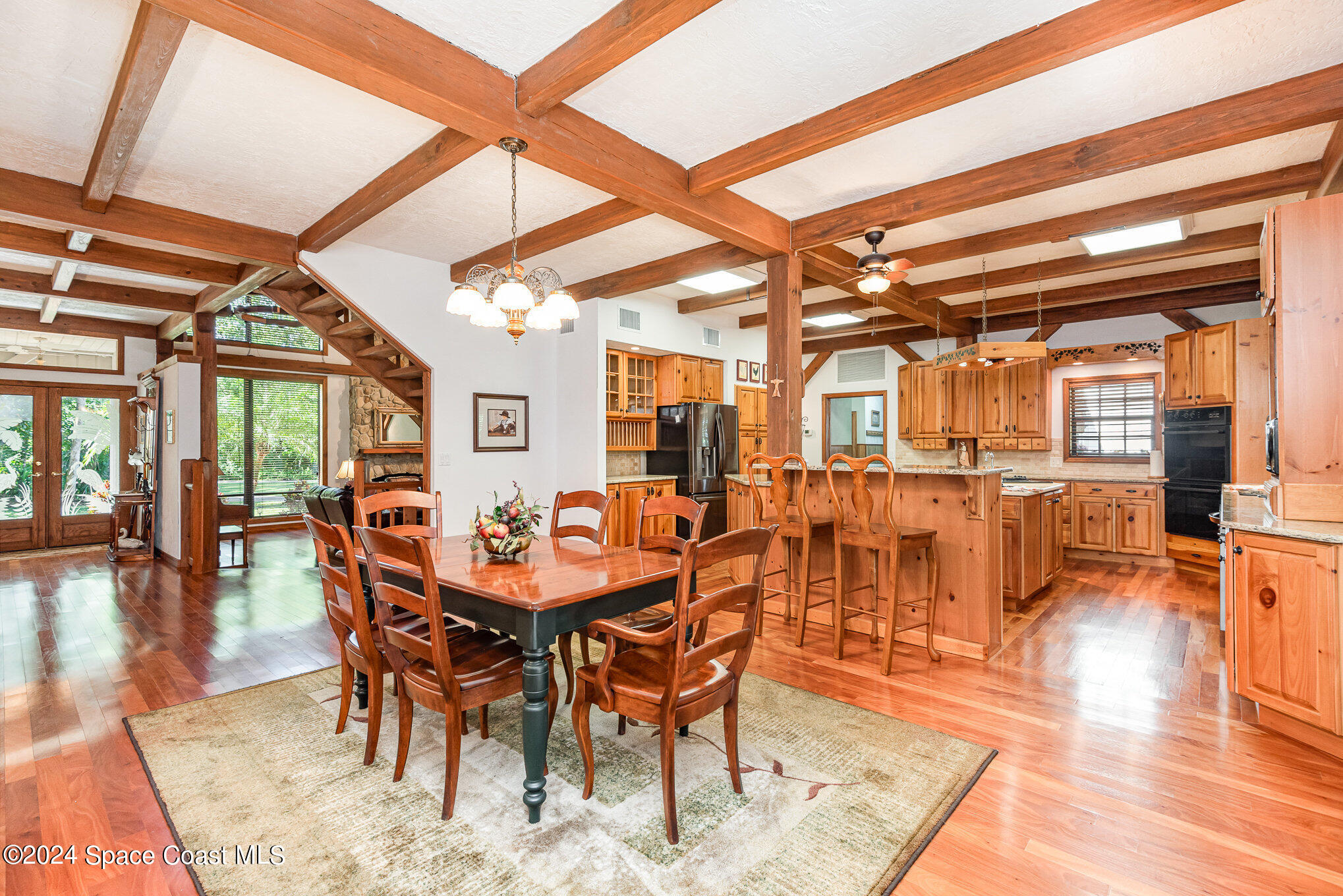3450 Grant Line Road Mims, FL 32754 - Photo 6 of 42 a dining room with furniture and wooden floor