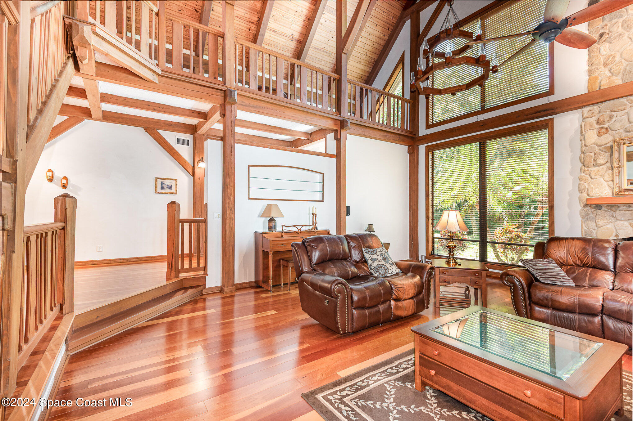 3450 Grant Line Road Mims, FL 32754 - Photo 7 of 42 a living room with furniture a large window and a rug