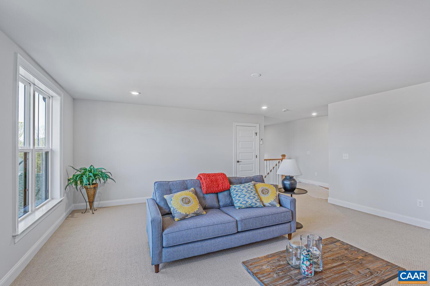 1731 Fowler Street Charlottesville, VA 22901 - Photo 40 of 45 a living room with furniture and a wooden floor