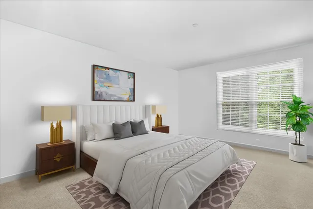 a bedroom with a bed and a couch