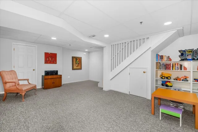 a room with furniture and stairs