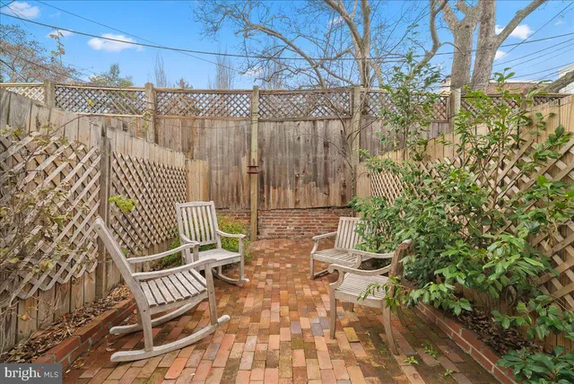 a view of a chair and table in the patio