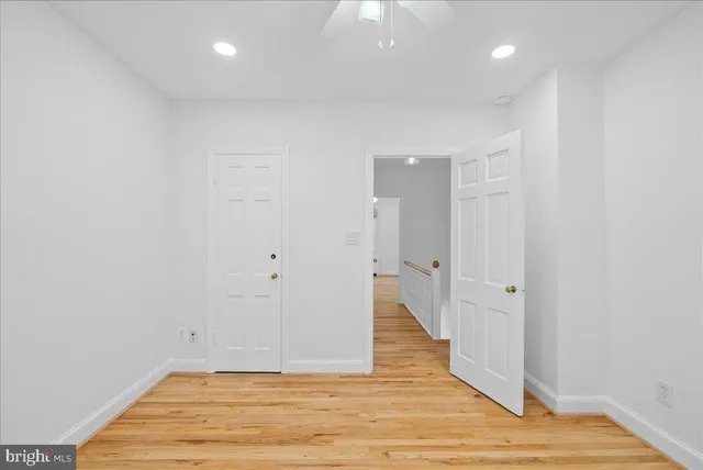 a view of a room with wooden floor