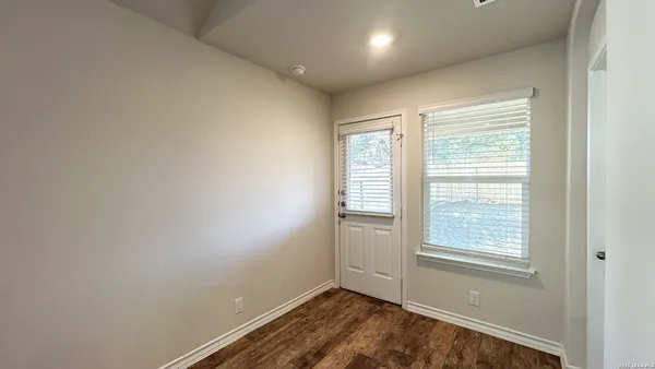 an empty room with windows