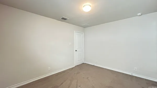 an empty room with a workbench