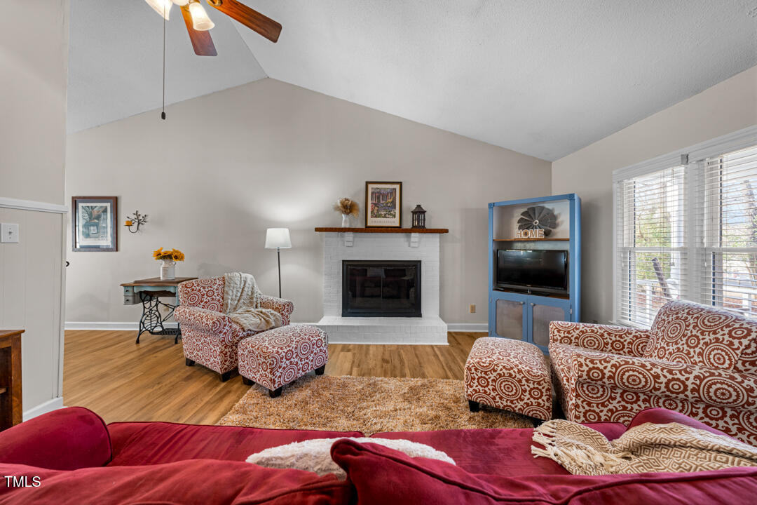 1008 Torredge Road Durham, NC 27712 - Photo 10 of 31 a living room with furniture or couch and a fireplace