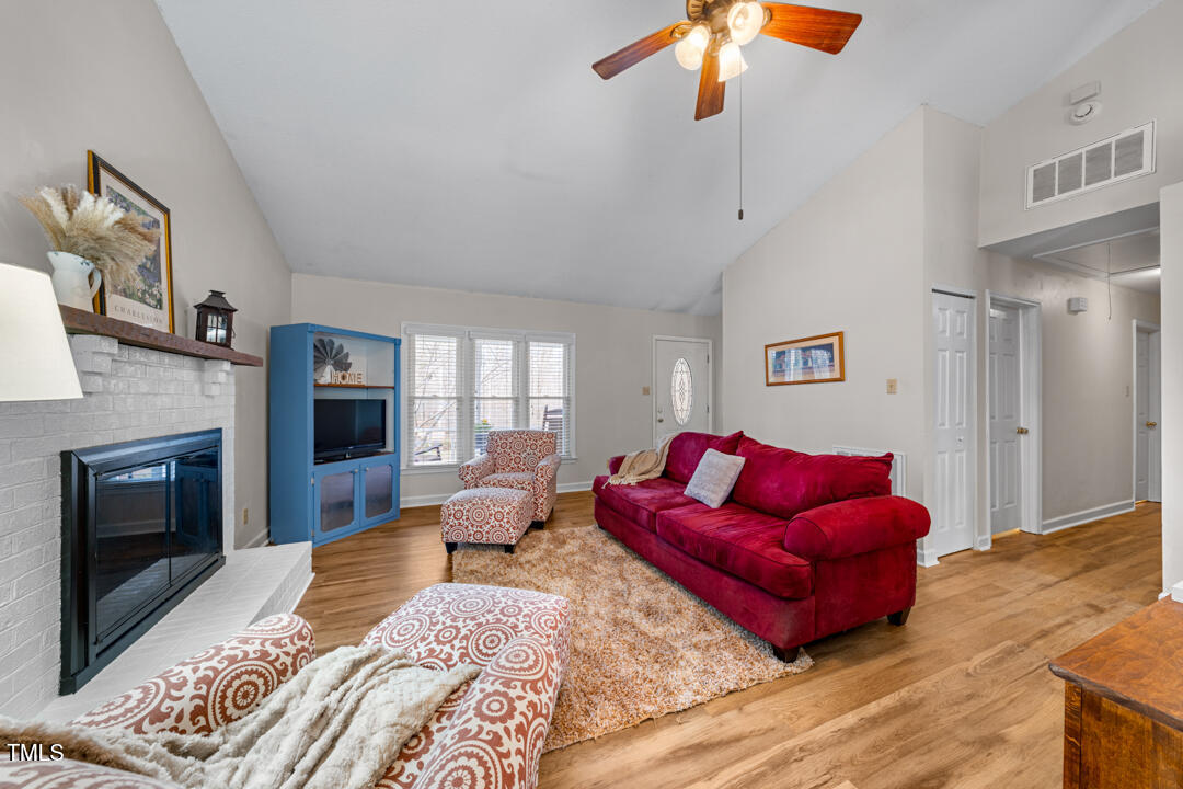 1008 Torredge Road Durham, NC 27712 - Photo 12 of 31 a bedroom with furniture or couch and a fireplace