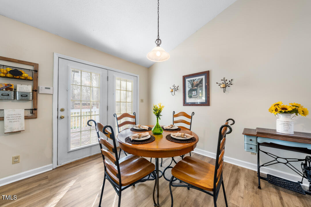 1008 Torredge Road Durham, NC 27712 - Photo 14 of 31 a view of a dining room with furniture window and wooden floor
