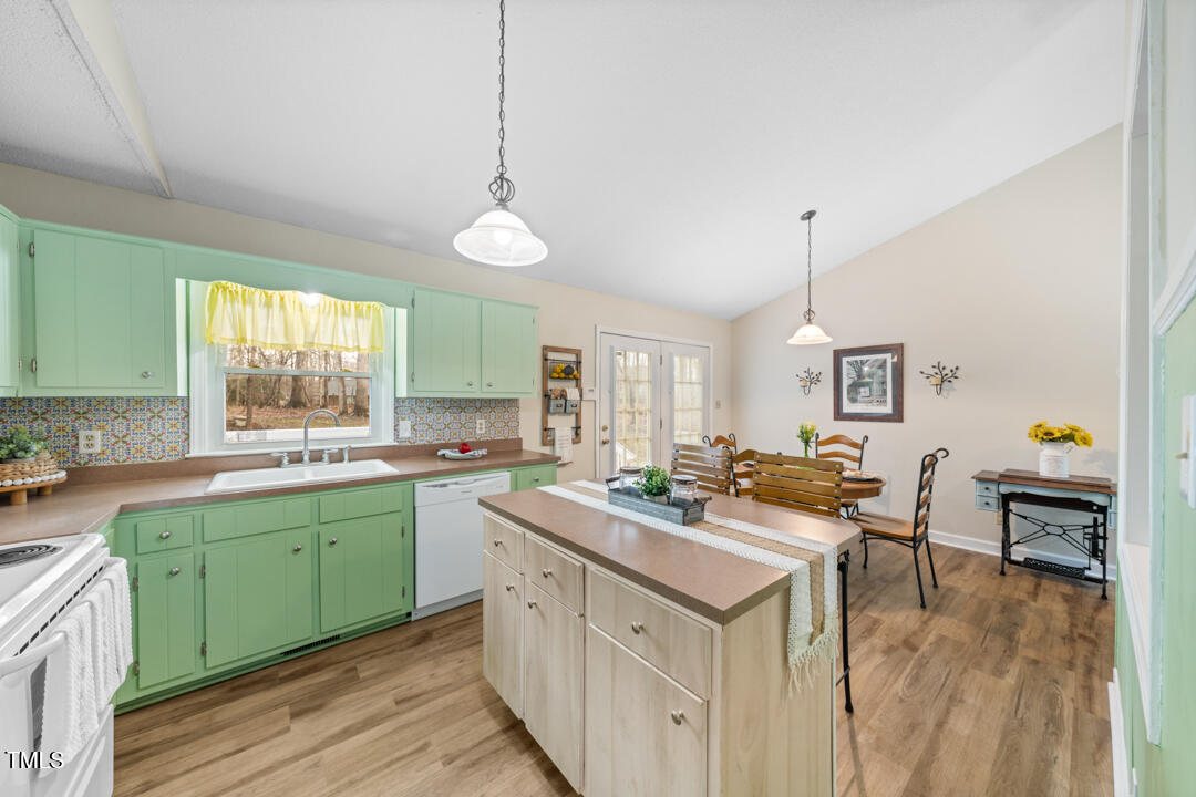 1008 Torredge Road Durham, NC 27712 - Photo 21 of 31 a kitchen with a sink stove and cabinets