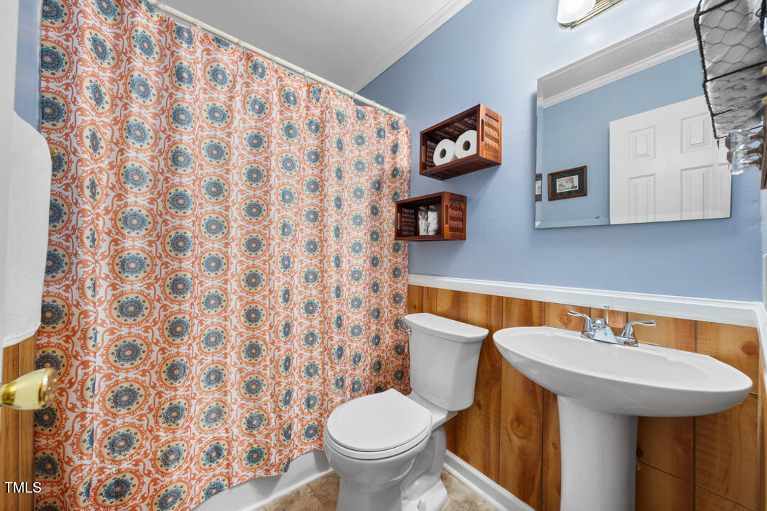 1008 Torredge Road Durham, NC 27712 - Photo 24 of 31 a bathroom with a sink and a toilet