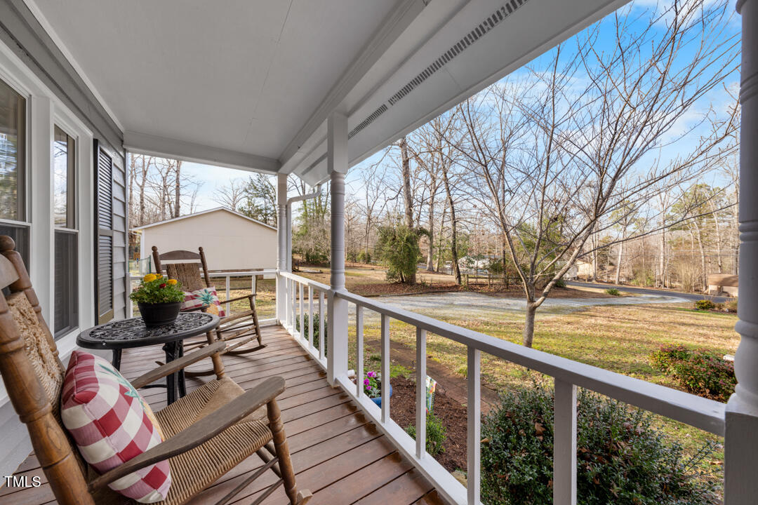 1008 Torredge Road Durham, NC 27712 - Photo 4 of 31 a view of balcony with wooden floor and outdoor seating