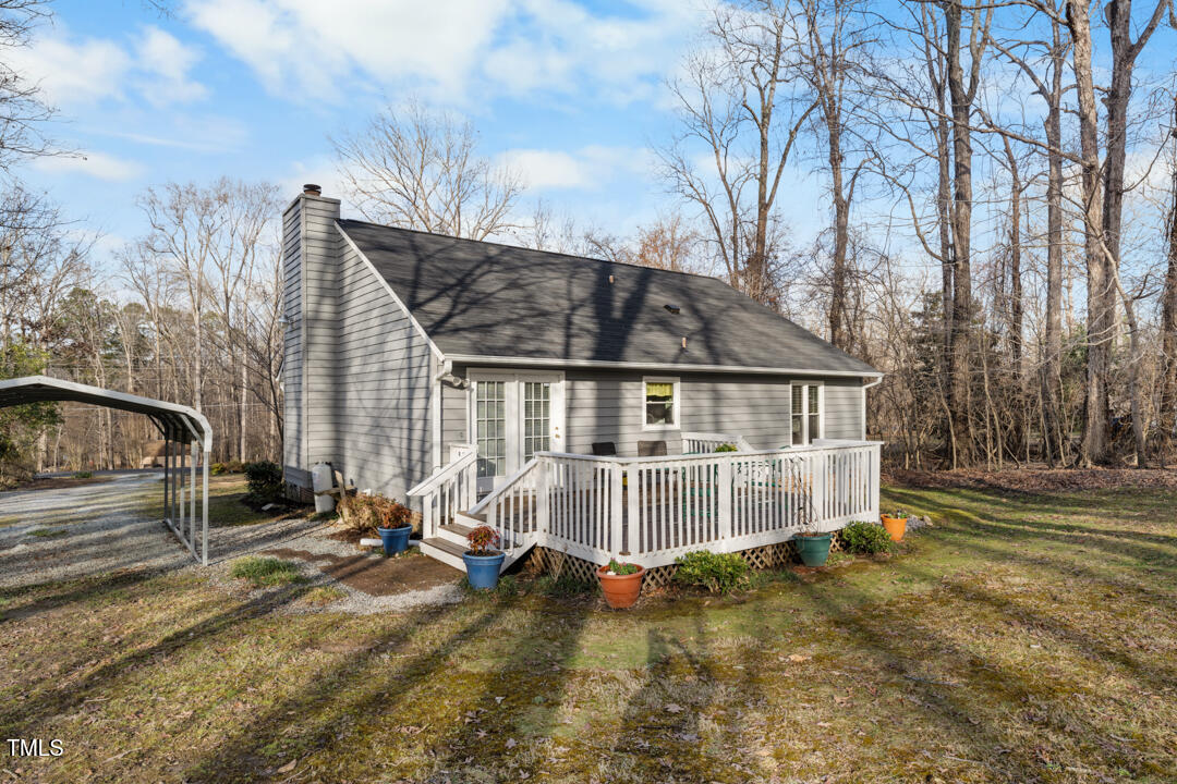 1008 Torredge Road Durham, NC 27712 - Photo 5 of 31 a view of a house with backyard and trees