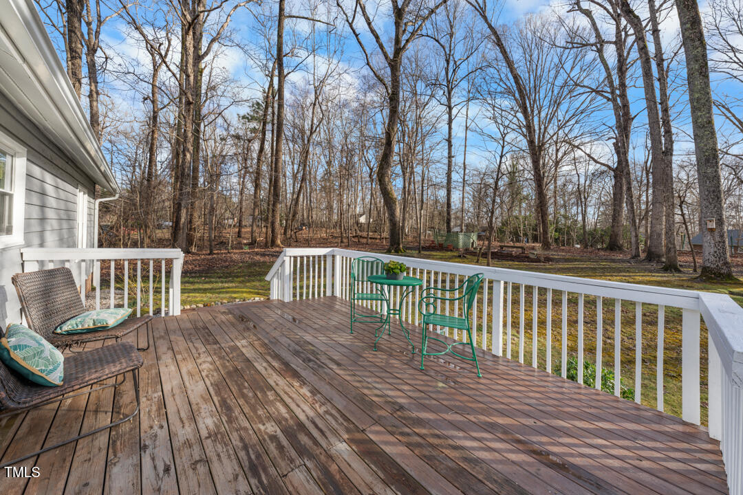 1008 Torredge Road Durham, NC 27712 - Photo 8 of 31 a view of a wooden deck with trees
