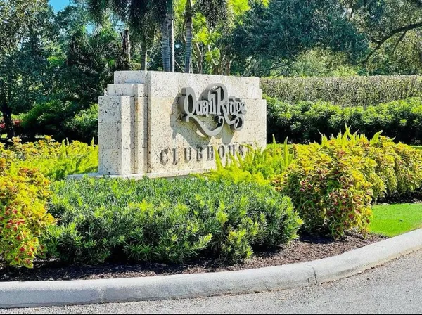 a sign that is next to a road