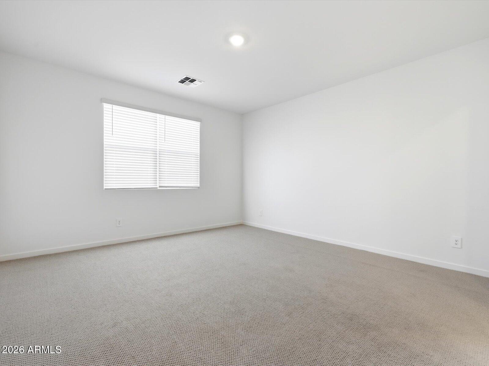 2392 Grenache Road San Tan Valley, AZ 85143 - Photo 12 of 67 an empty room with a window