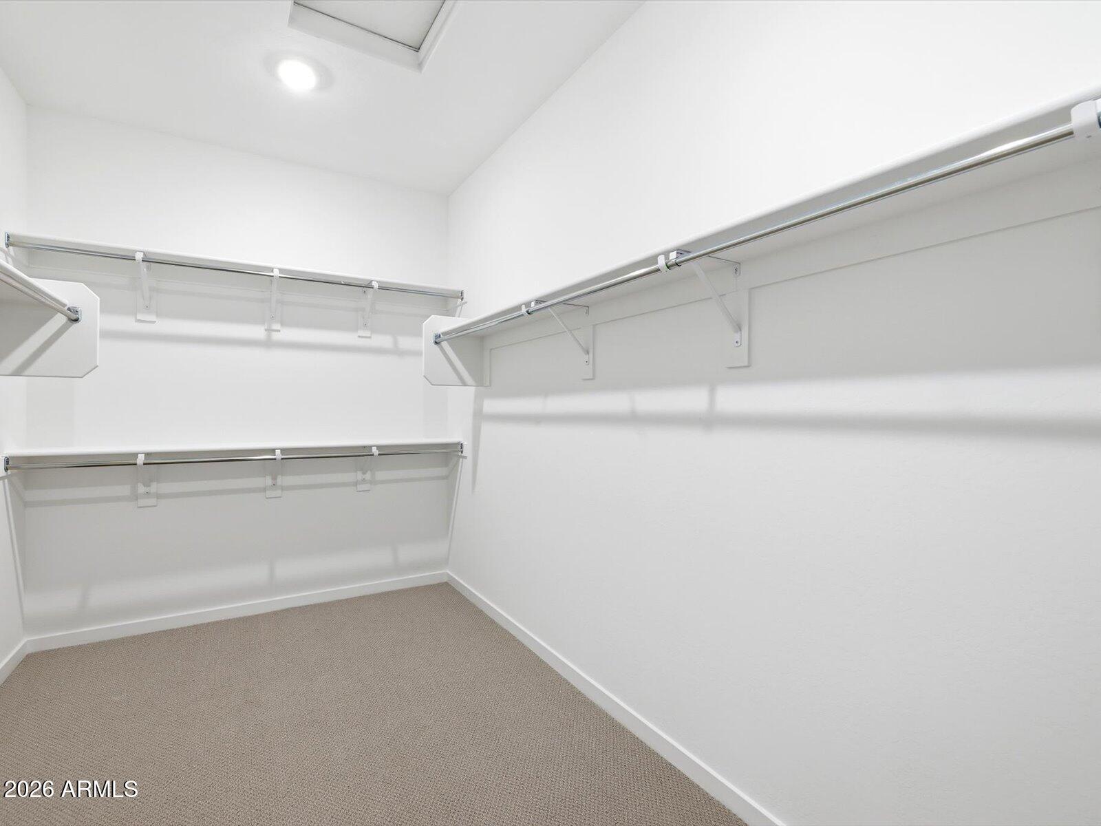 2392 Grenache Road San Tan Valley, AZ 85143 - Photo 16 of 67 a view of an empty walk in closet