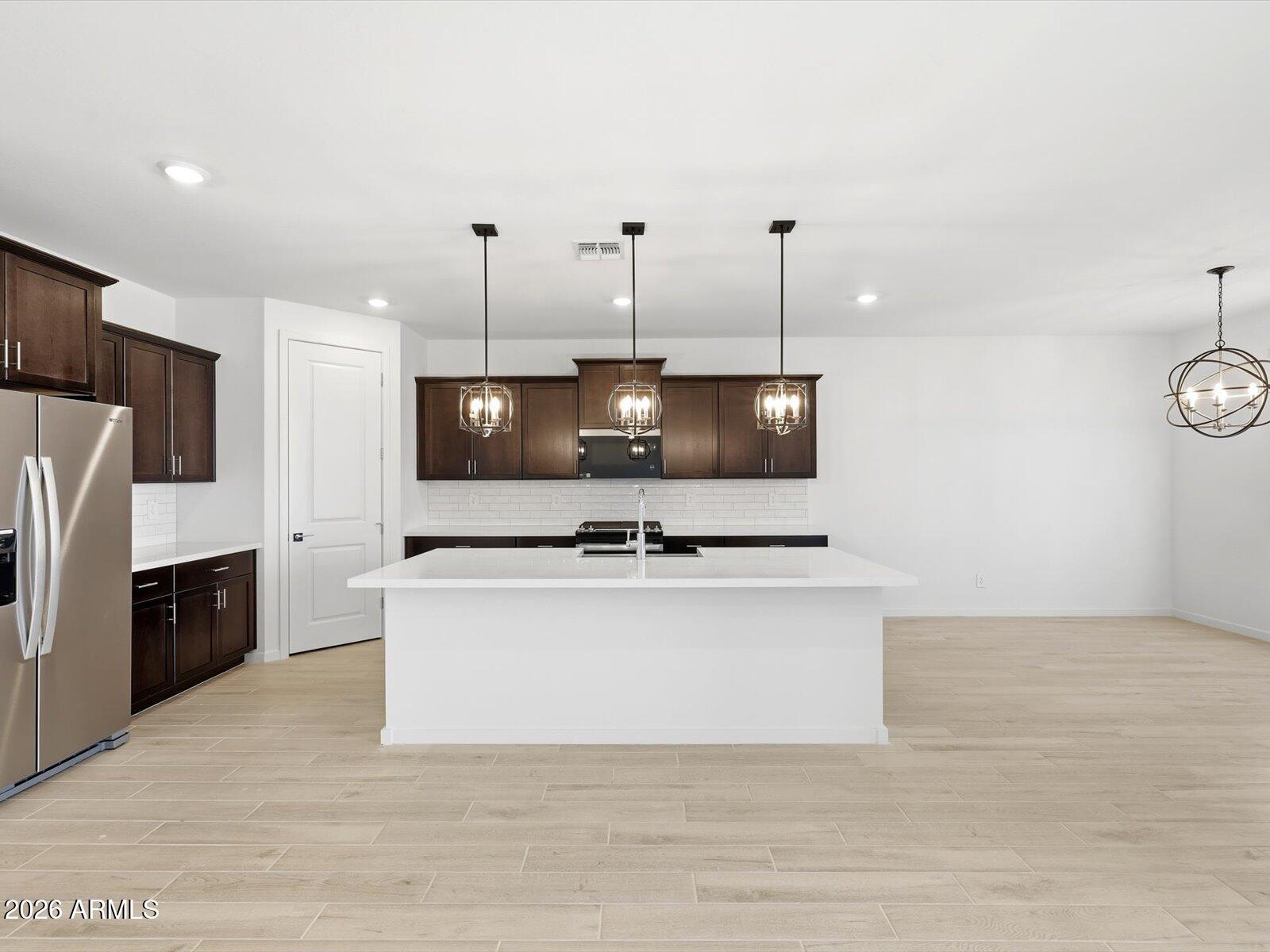 2392 Grenache Road San Tan Valley, AZ 85143 - Photo 19 of 67 a living room with furniture and a flat screen tv