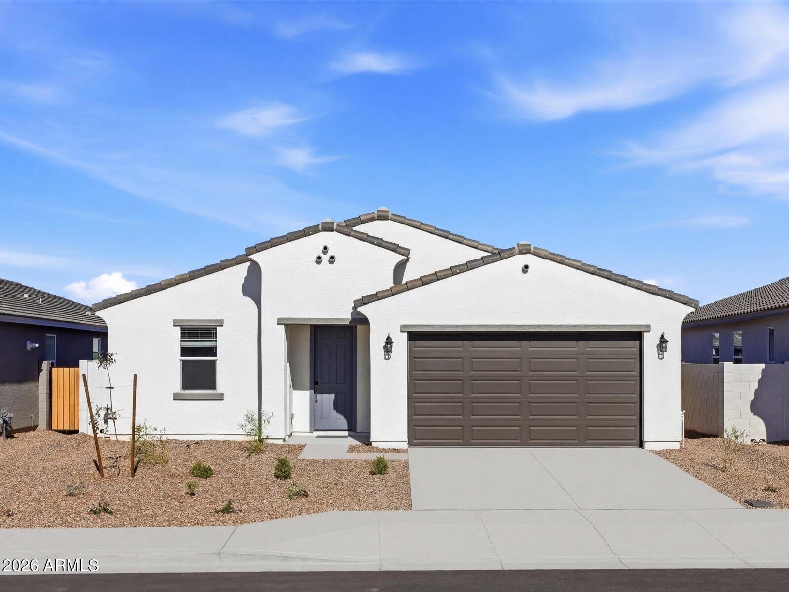 2392 Grenache Road San Tan Valley, AZ 85143 - Photo 2 of 67 a front view of a house with a garage