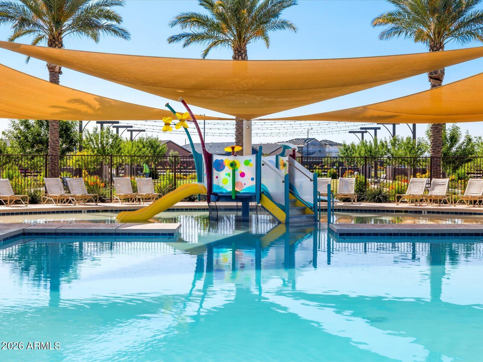 2392 Grenache Road San Tan Valley, AZ 85143 - Photo 45 of 67 a view of swimming pool with lounge chair and dinning table