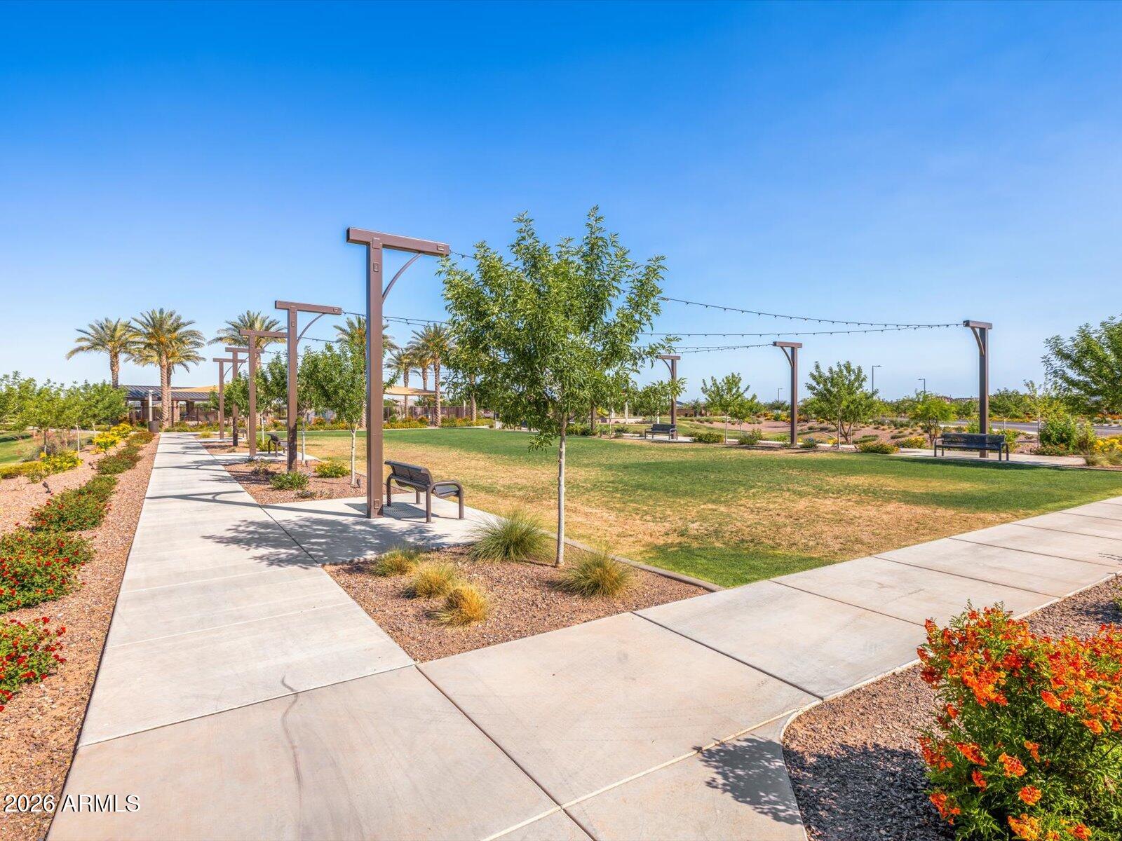 2392 Grenache Road San Tan Valley, AZ 85143 - Photo 55 of 67 a view of a swimming pool with an outdoor space and seating area
