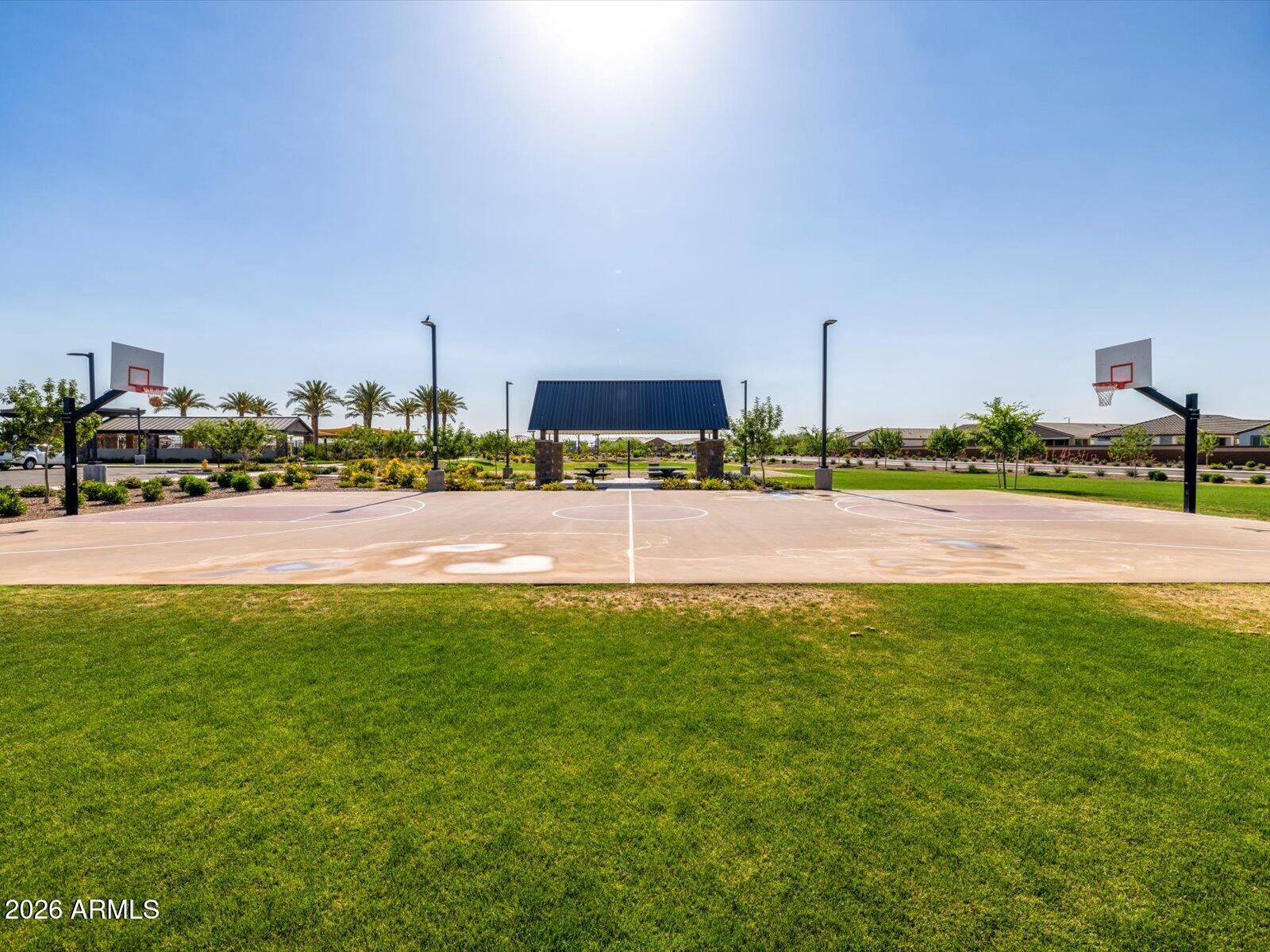 2392 Grenache Road San Tan Valley, AZ 85143 - Photo 56 of 67 a view of a building with a big yard and large trees