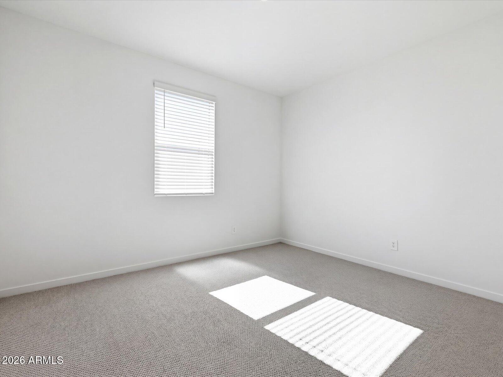 2392 Grenache Road San Tan Valley, AZ 85143 - Photo 5 of 67 an empty room with a window