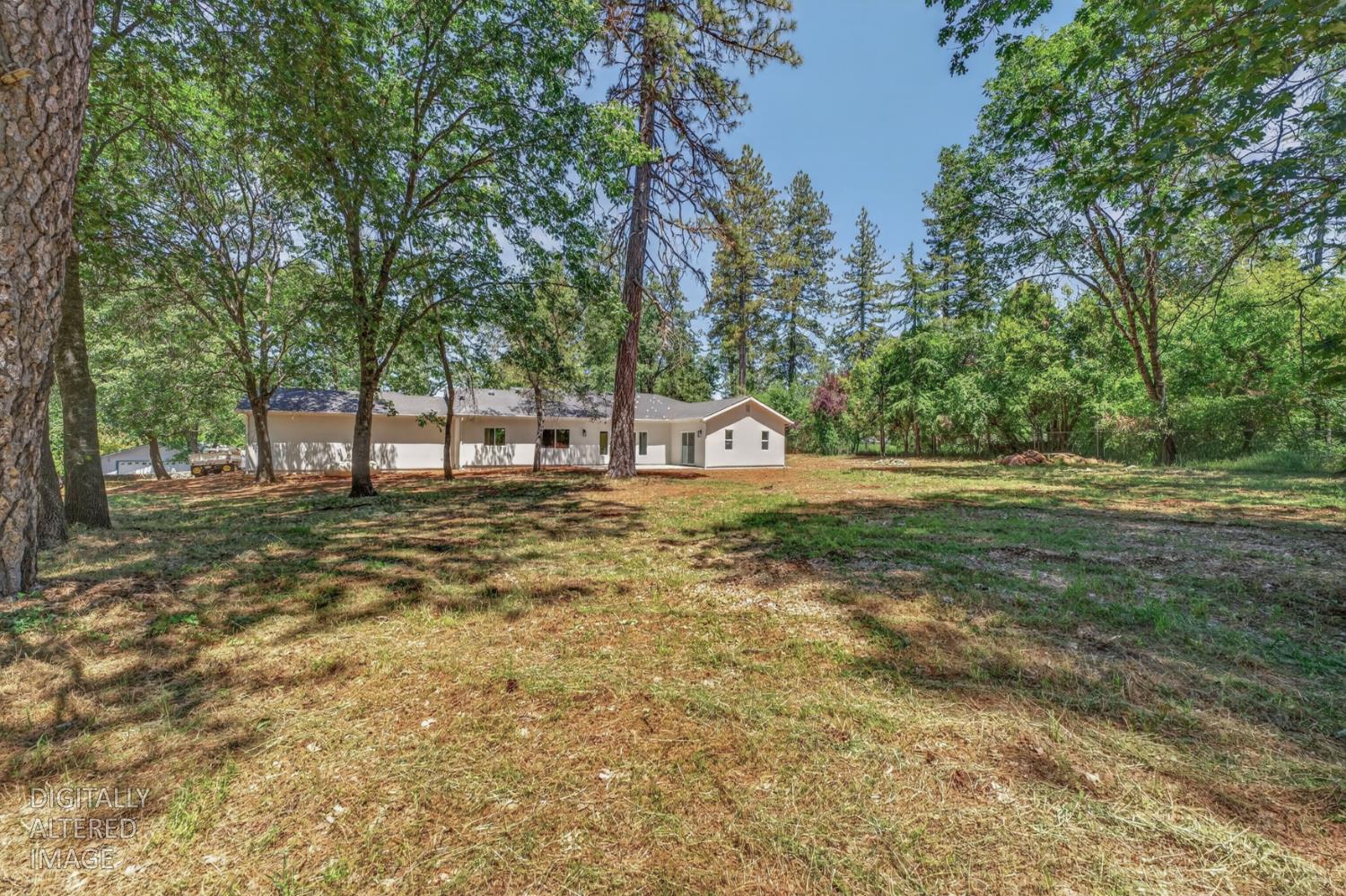 280 Jan Road Grass Valley, CA 95945 - Photo 39 of 66 a backyard of a house with lots of green space