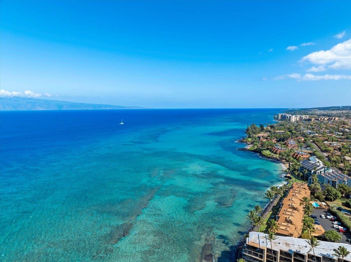 3788 Lower Honoapiilani Road, Unit A114 Lahaina, HI 96761 - Photo 2 of 18 an aerial view of a houses with a yard