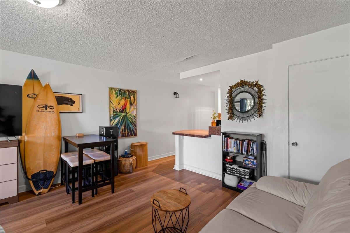 3788 Lower Honoapiilani Road, Unit A114 Lahaina, HI 96761 - Photo 10 of 18 a living room with furniture and a mirror